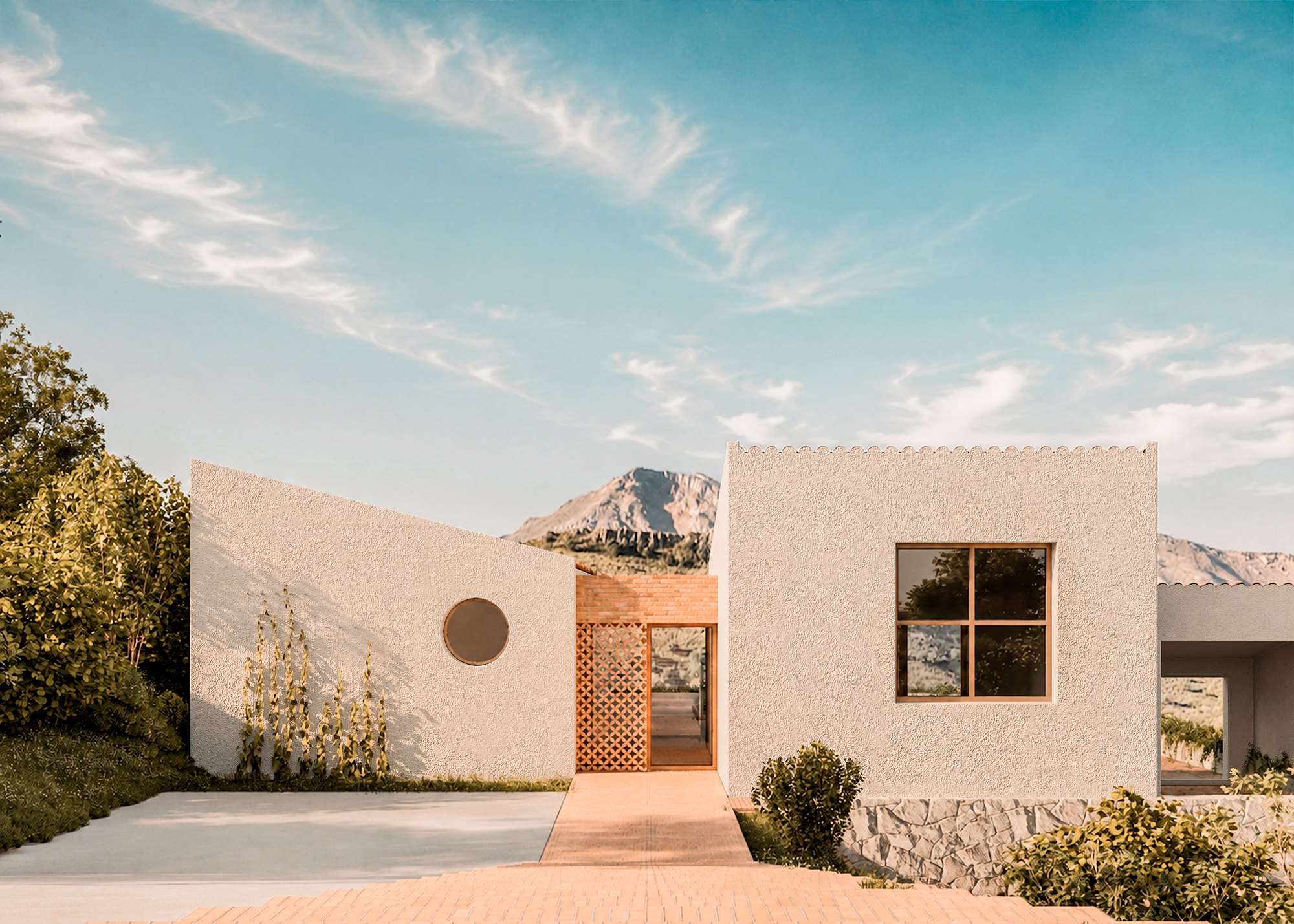 Casa Ante Que Era? — acceso a la vivienda entre volúmenes encalados.